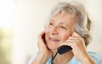 Woman speaking to a will writer on the phone